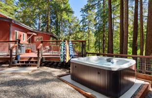 Book a hot tub under the redwood trees! This one is at Everwood.